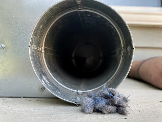 Westmont Dryer Vent Cleaning technician using specialized equipment to clear severe dryer vent blockage in Westmont